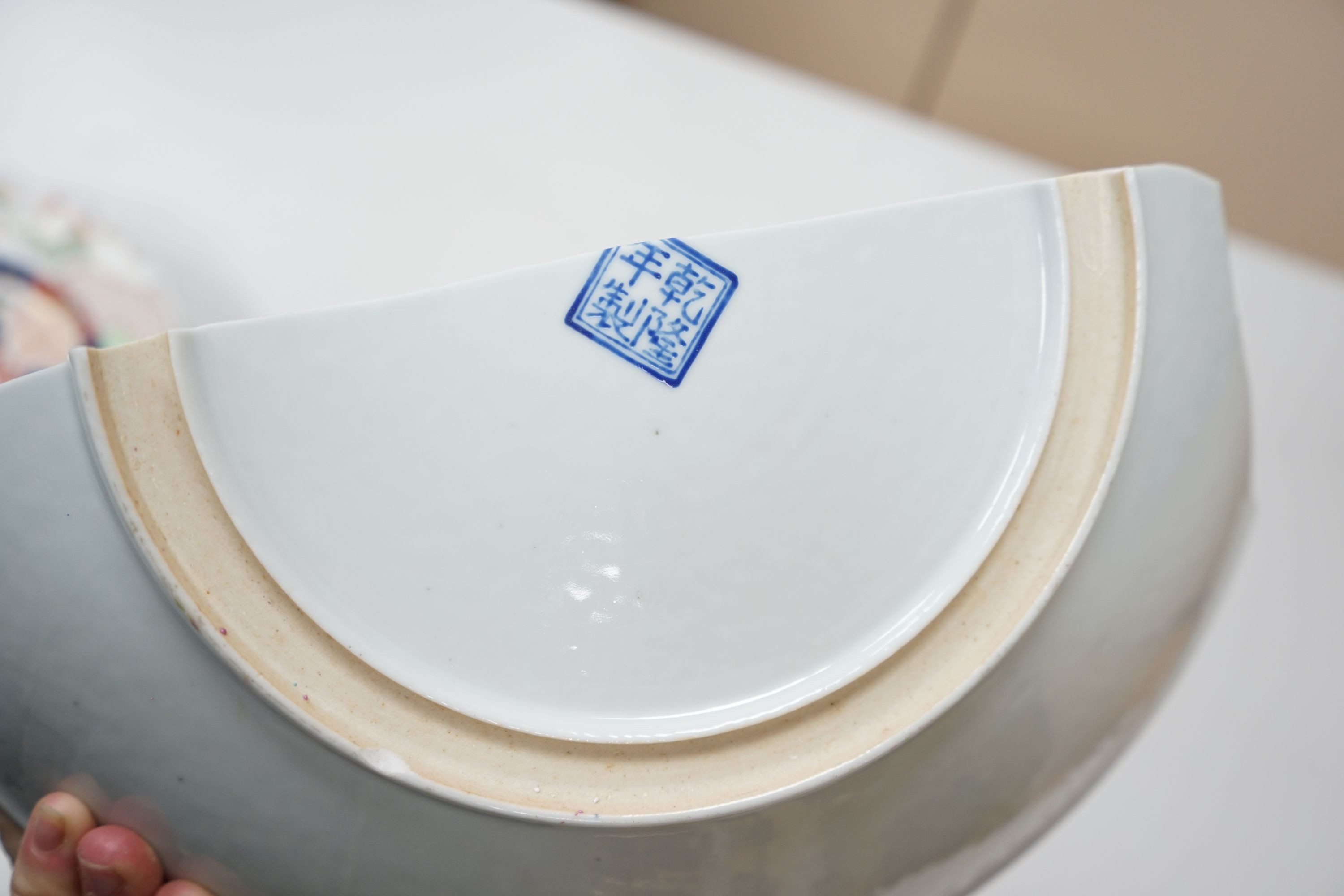 A 19th century Japanese Imari dish, 30cm and a damaged Chinese famille rose dish, 33.5cm 34cm